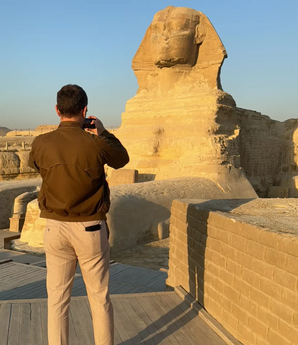 Our guest Taking a photo of the Sphinx during our Private Egypt tours
