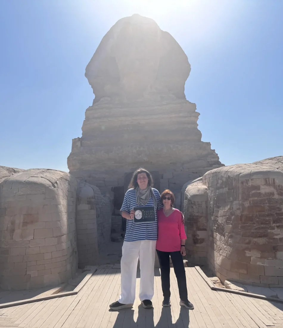 our guests between the Paws of the Sphinx as a part of our private access to the Sphinx visit